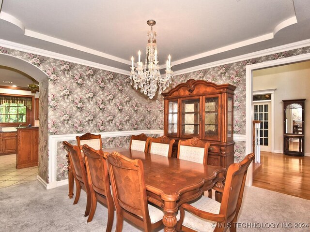 13706 S 18th St, Bixby, OK 74008 - dining space featuring crown molding, a tray ceiling, a chandelier, and light carpet