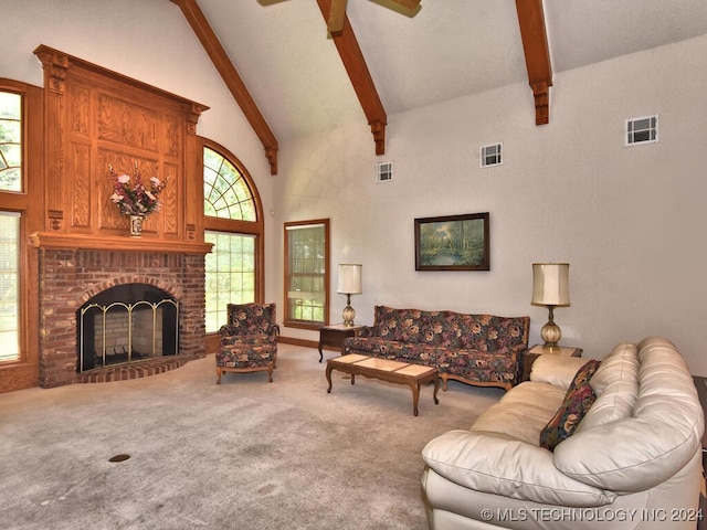 carpeted living room featuring ceiling fan, high vaulted ceiling, a fireplace, and beamed ceiling