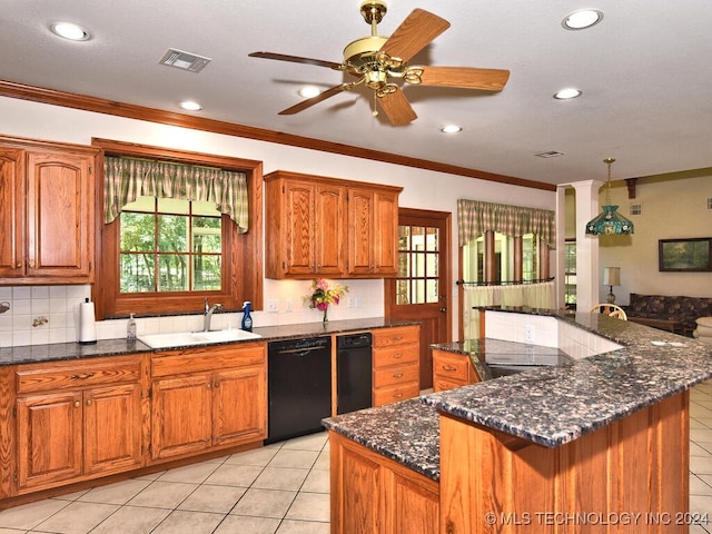 13706 S 18th St, Bixby, OK 74008 - kitchen with black dishwasher, sink, a kitchen island, and a wealth of natural light