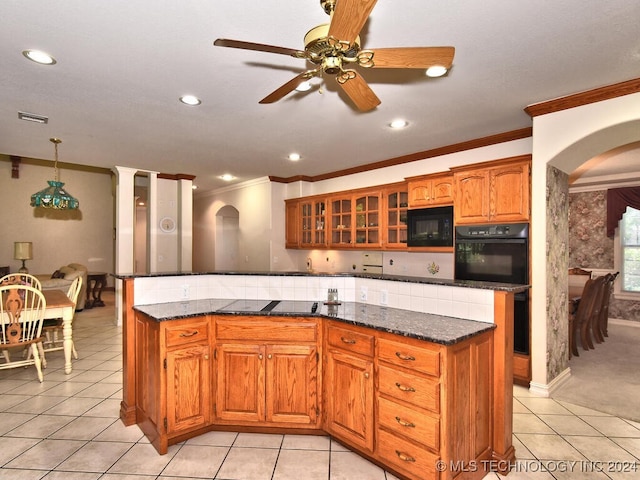 kitchen featuring dark stone countertops, pendant lighting, ceiling fan, light tile patterned flooring, and black appliances