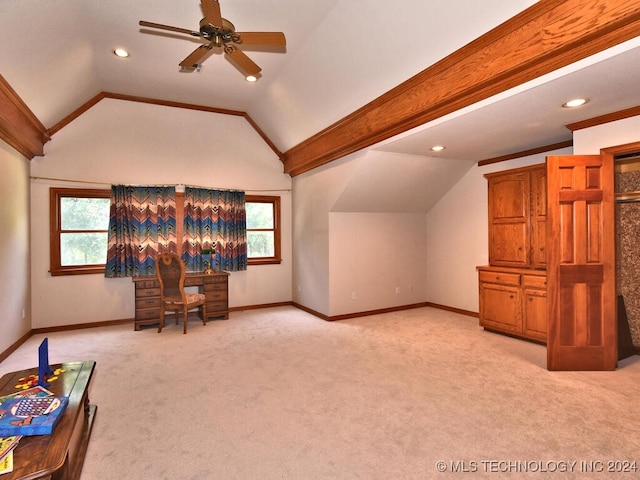 unfurnished living room with ceiling fan, a wealth of natural light, lofted ceiling, and light carpet