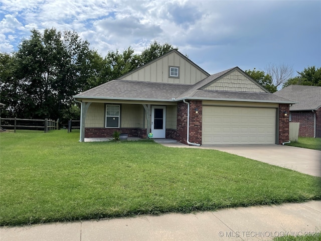 view of front of property featuring a garage and a front yard