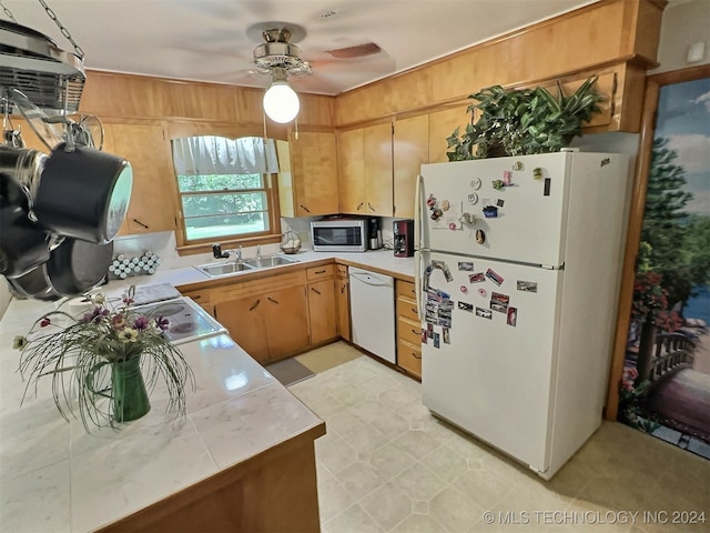 kitchen featuring light tile patterned floors, white appliances, sink, and ceiling fan