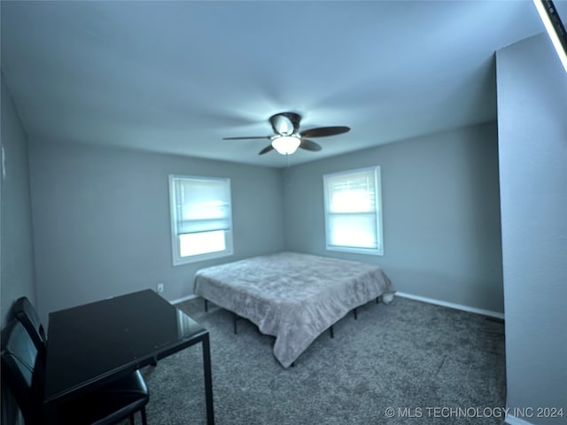 carpeted bedroom with ceiling fan