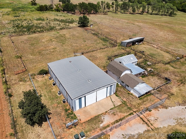 birds eye view of property with a rural view