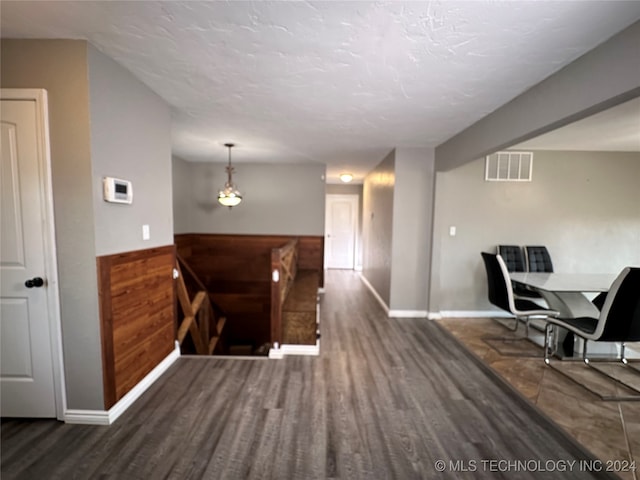 hallway featuring dark hardwood / wood-style floors