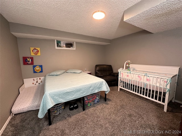 carpeted bedroom featuring a textured ceiling