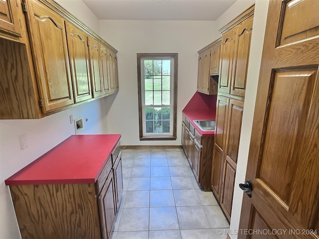 kitchen with sink and light tile patterned floors