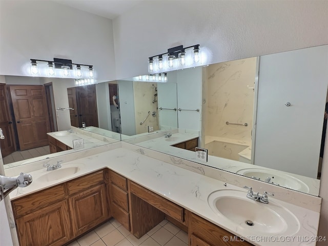 bathroom with tile patterned floors and double vanity