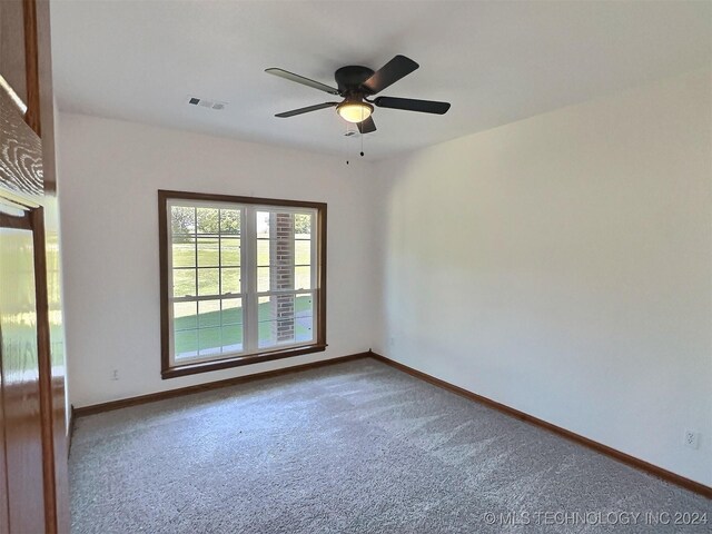 carpeted empty room with ceiling fan