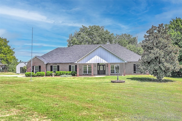 single story home with a garage and a front lawn