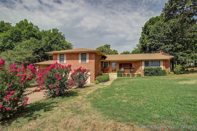 tri-level home with a front yard