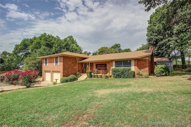 view of front of house with a garage and a front yard