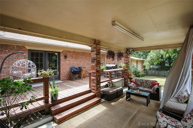 wooden deck with outdoor lounge area