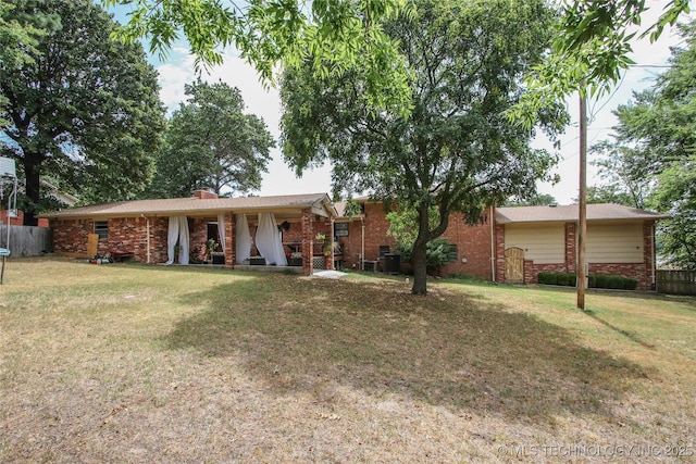 ranch-style house featuring a front lawn