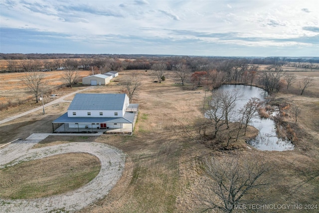 birds eye view of property featuring a rural view and a water view