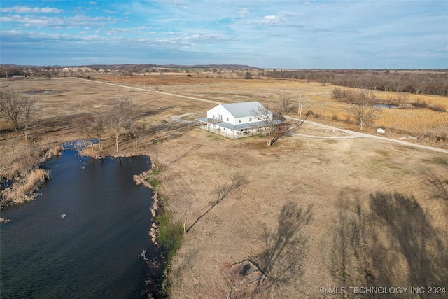 drone / aerial view featuring a water view and a rural view