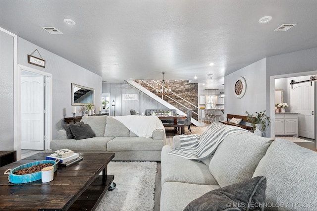 living room featuring a barn door