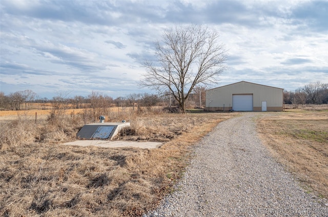 exterior space with a rural view and an outbuilding