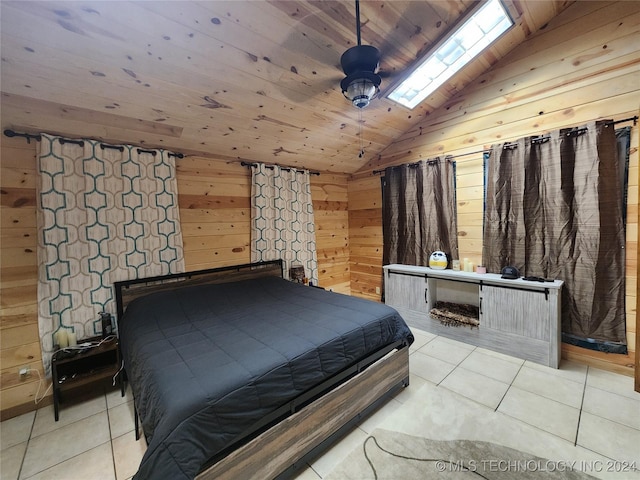 bedroom featuring lofted ceiling, light tile patterned floors, wood ceiling, and wooden walls