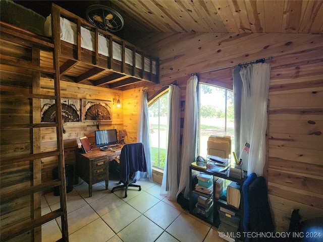 office space with wooden ceiling, wooden walls, vaulted ceiling, and light tile patterned flooring