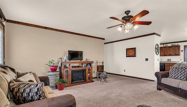 carpeted living room featuring ceiling fan and ornamental molding