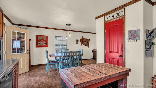 dining space with crown molding and dark hardwood / wood-style floors