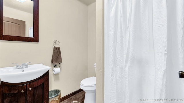 bathroom with vanity and toilet