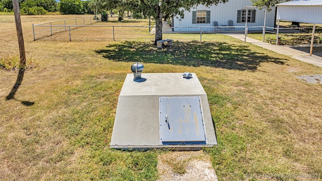 view of storm shelter with a yard