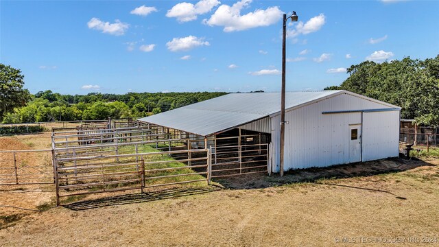 view of outbuilding featuring a rural view