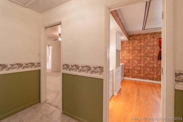 corridor with light tile patterned floors