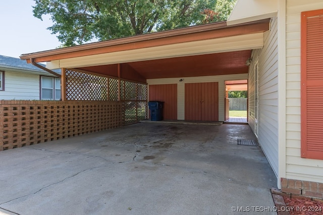 view of vehicle parking featuring a carport