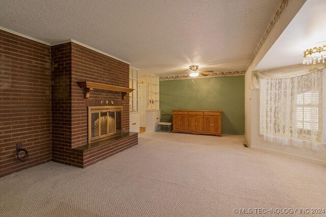 unfurnished living room with brick wall, carpet flooring, and a brick fireplace