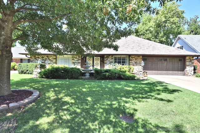 ranch-style house with a front yard and a garage