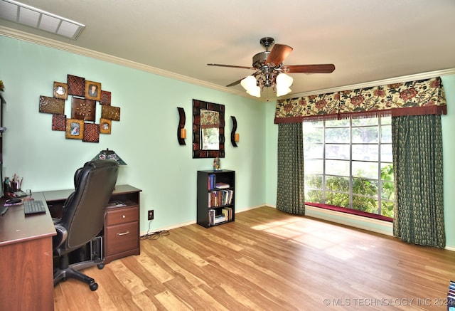 home office with ceiling fan, crown molding, and light hardwood / wood-style flooring