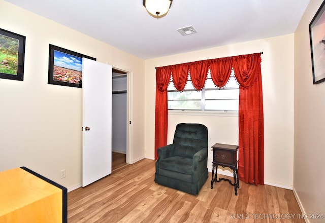 sitting room with light hardwood / wood-style flooring