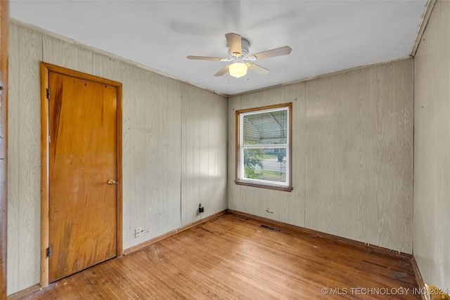 spare room with ceiling fan and light hardwood / wood-style flooring