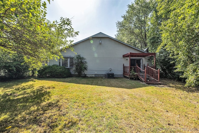 back of house with a pergola and a yard