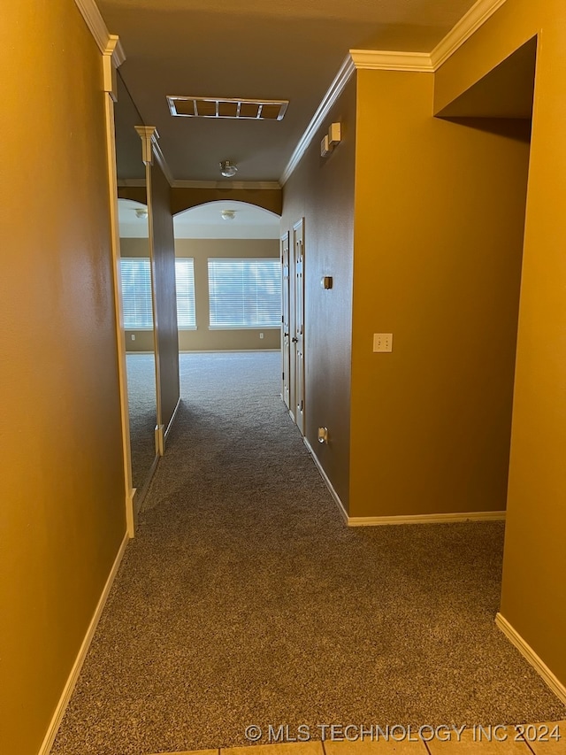 hall with carpet and crown molding