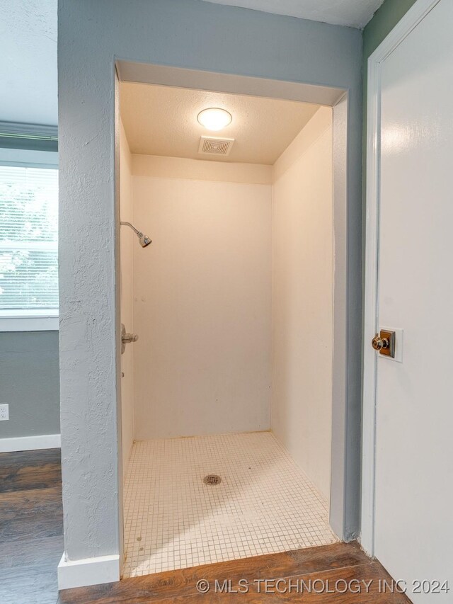 bathroom featuring walk in shower