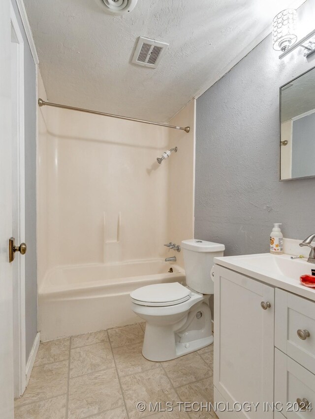 full bathroom featuring shower / tub combination, vanity, a textured ceiling, and toilet