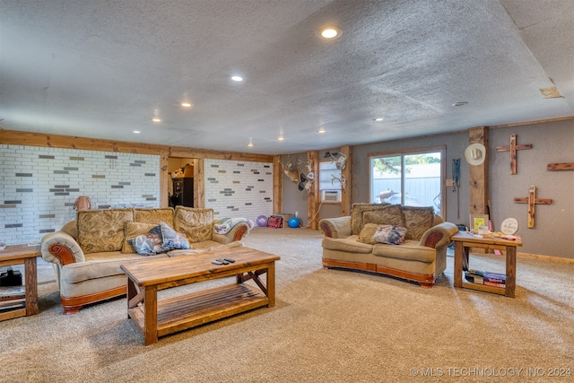 carpeted living room featuring a textured ceiling