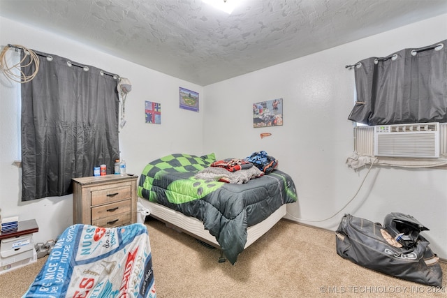 bedroom with carpet floors, a textured ceiling, and cooling unit