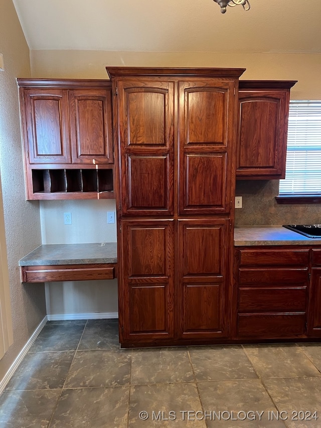 kitchen featuring built in desk and tile patterned floors