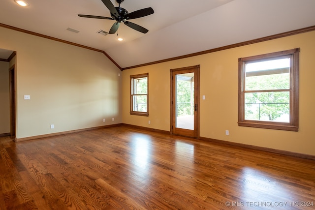 unfurnished room with ceiling fan, hardwood / wood-style floors, vaulted ceiling, and ornamental molding