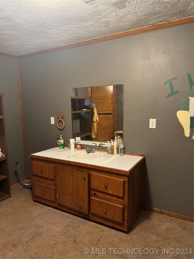 bathroom with a textured ceiling and vanity