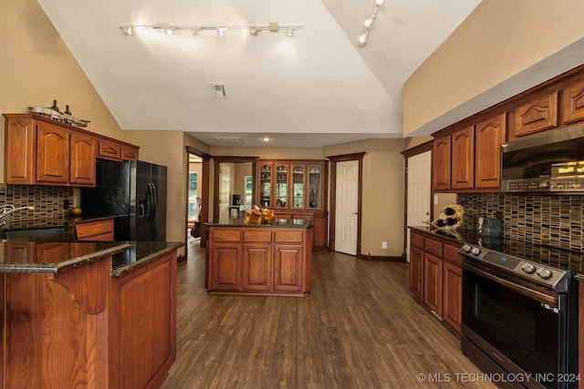 kitchen featuring stainless steel appliances, tasteful backsplash, sink, and dark hardwood / wood-style flooring