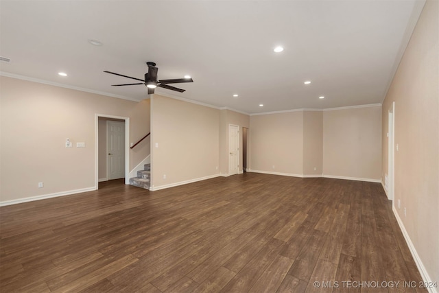 spare room with ornamental molding, dark hardwood / wood-style floors, and ceiling fan