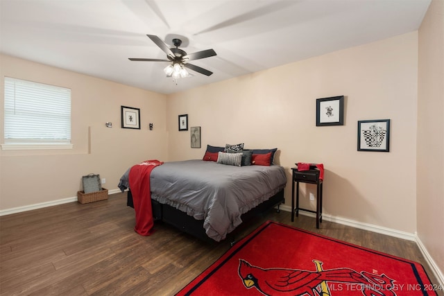 bedroom with dark wood-type flooring and ceiling fan