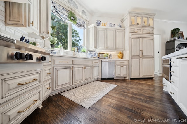 kitchen with dark wood-type flooring, stainless steel dishwasher, ornamental molding, and tasteful backsplash